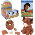 Hatching highland cow growing egg